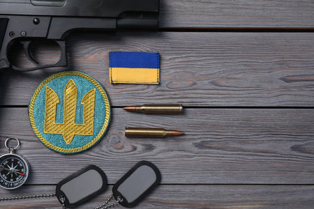 MYKOLAIV, UKRAINE - SEPTEMBER 19, 2020: Flat lay composition with Ukraine military equipment on gray wooden tableのeditorial素材