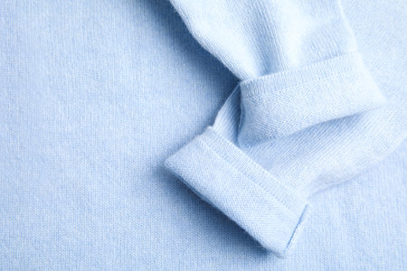 Warm cashmere sweater as background, top viewの写真素材