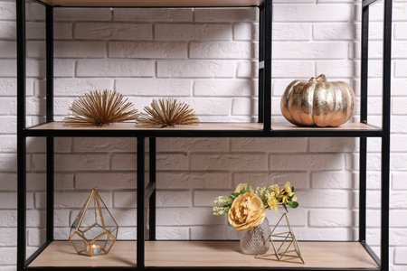Shelving with different decor near white brick wall. interior designの写真素材