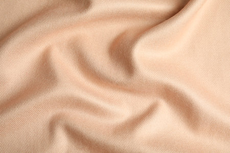 Beige soft cashmere fabric as background, closeupの写真素材