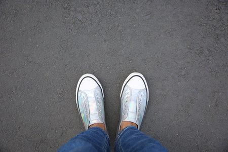 Woman standing outdoors, top view. Space for textの写真素材