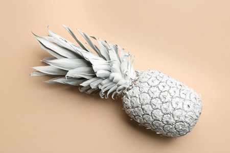 White pineapple on beige background, top view. creative conceptの写真素材