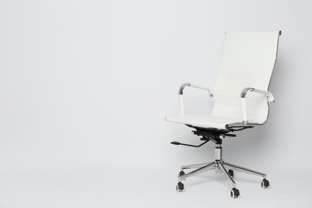 Comfortable office chair on white background, space for textの写真素材