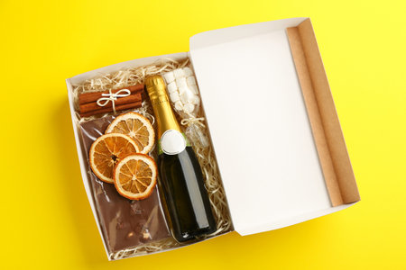 Stylish gift set on yellow background, top viewの写真素材