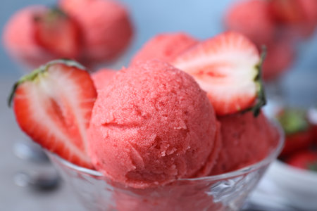 Delicious strawberry ice cream with fresh berry in dessert bowl, closeupの写真素材