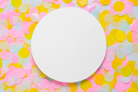 Card on bright confetti, top view. Space for text