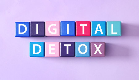 Color cubes with words DIGITAL DETOX on violet background, flat layの写真素材