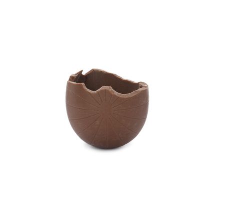 Broken milk chocolate egg on white background