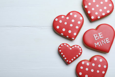 Delicious heart shaped cookies on white wooden table, flat lay with space for text. Valentine's Dayの写真素材