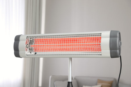 Modern electric infrared heater in living roomの写真素材
