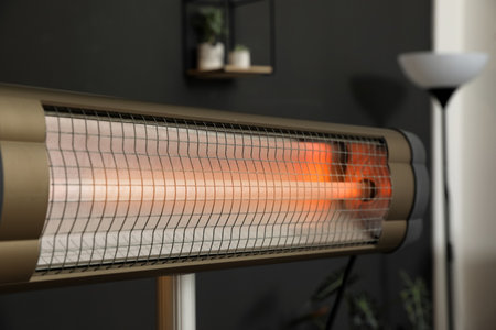Modern electric infrared heater in room interior, closeupの写真素材