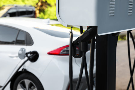 Electric vehicle charging station outdoors. modern technologyの写真素材