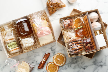 Stylish gift sets on white marble table, flat layの写真素材