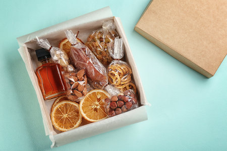 Stylish gift set on light blue background, flat layの写真素材