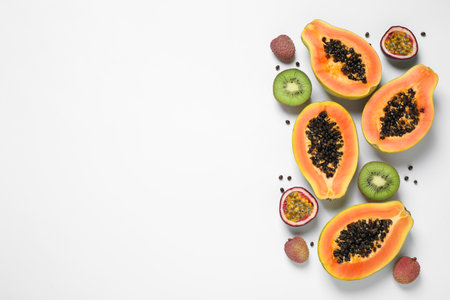 Fresh ripe papaya and other fruits on white background, top viewの写真素材