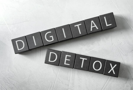 Black cubes with words DIGITAL DETOX on white background, flat layの写真素材