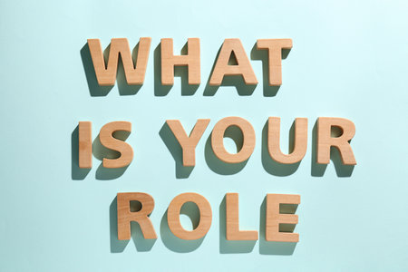 Phrase What Is Your Role made of wooden letters on light blue background, flat layの写真素材