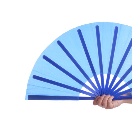 Woman holding blue hand fan on white background, closeupの写真素材