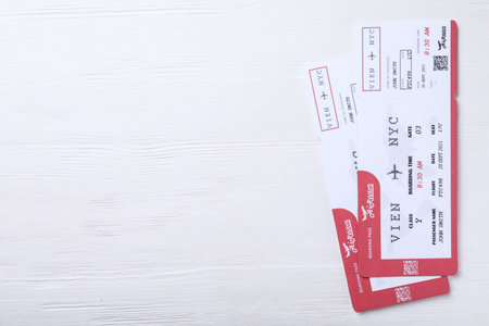 Tickets on white wooden table, flat lay with space for text. travel agency conceptの写真素材