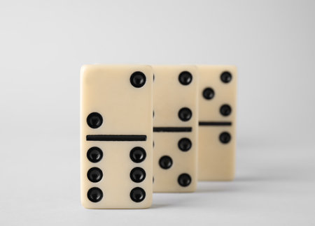 Row of domino tiles on white background, closeupの写真素材