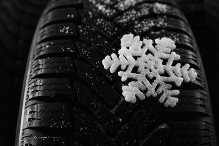 Snowy new winter tires as background, closeupの写真素材