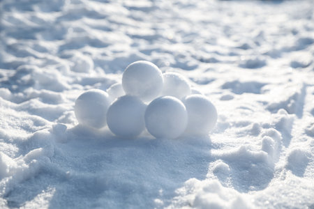 Pile of snowballs outdoors on sunny winter dayの写真素材