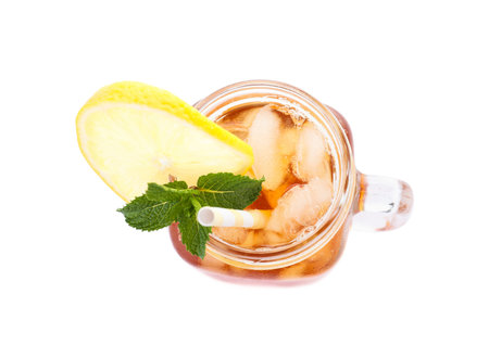 Delicious iced tea in mason jar on white background, top viewの写真素材