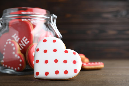 Delicious heart shaped cookies on wooden table, closeup with space for text. Valentine's Dayの写真素材