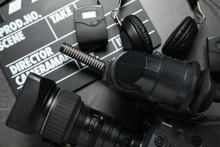 Camera and video production equipment on grey background, top viewの写真素材