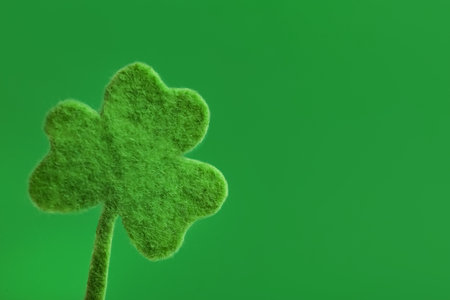 Decorative clover leaf on green background, space for text. Saint Patrick's Day celebrationの写真素材