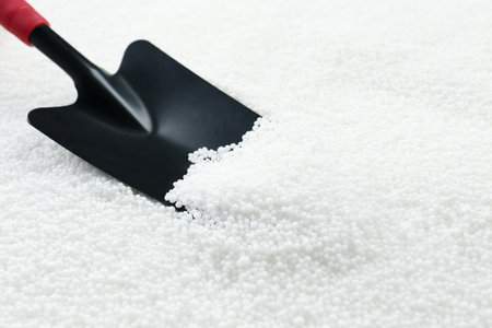 Shovel and granular mineral fertilizer, closeup viewの写真素材
