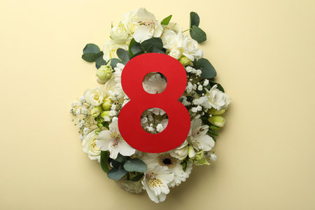 8 March greeting card design with beautiful white flowers on beige background, flat lay....