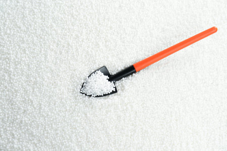 Shovel and granular mineral fertilizer, top viewの写真素材