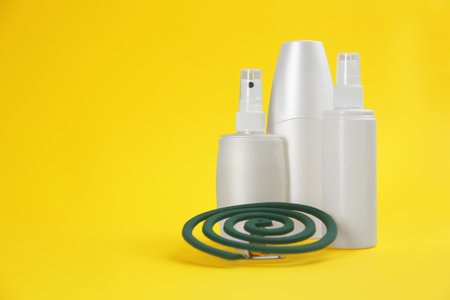 Set of different insect repellents on yellow background. Space for textの写真素材