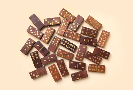 Wooden domino tiles on beige background, flat layの写真素材