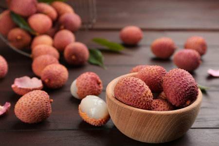 Fresh ripe lychee fruits on wooden tableの写真素材