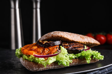 Delicious eggplant sandwich on slate board, closeupの写真素材