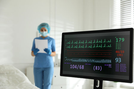 Monitor with cardiogram in hospital, focus on screen. Space for textの写真素材