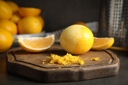 Lemon zest and fresh fruits on gray table, closeupの写真素材