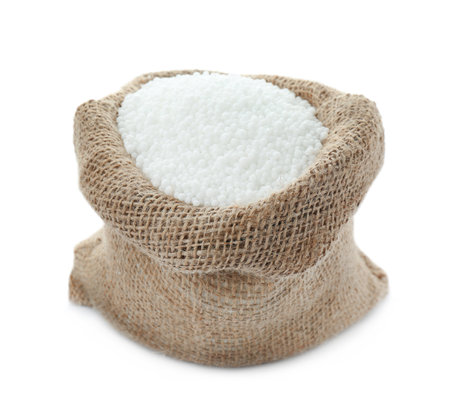 Pellets of ammonium nitrate in bag isolated on white. Mineral fertilizerの写真素材