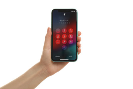 MYKOLAIV, UKRAINE - JULY 9, 2020: Woman holding iPhone X with lock screen on white background, closeupのeditorial素材