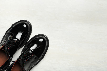 Pair of stylish female shoes on white wooden table, flat lay. Space for textの写真素材