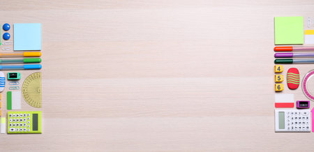 Different school stationery on wooden table, flat lay. Space for text