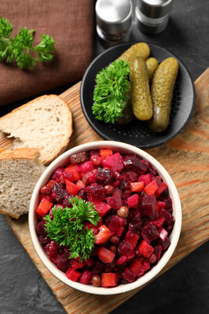 Traditional Russian salad vinaigrette served on gray table, flat layの写真素材