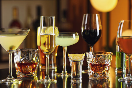 Different alcohol drinks on table in barの写真素材