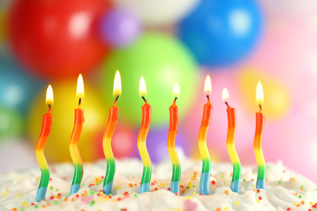 Birthday cake with burning candles on blurred background, closeupの写真素材