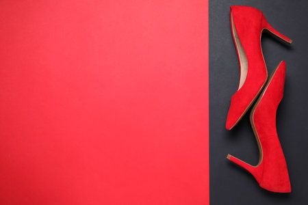 Stylish women's shoes on color background, top view. Space for textの写真素材