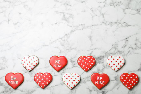Valentine's day cookies on white marble table, flat lay. Space for textの写真素材