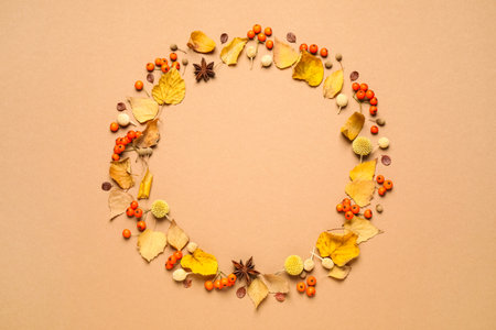 Flat lay composition with autumn leaves on beige background, space for textの写真素材