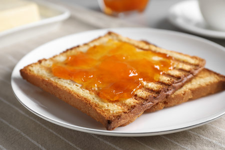 Tasty toasts with jam served on table, closeupの写真素材